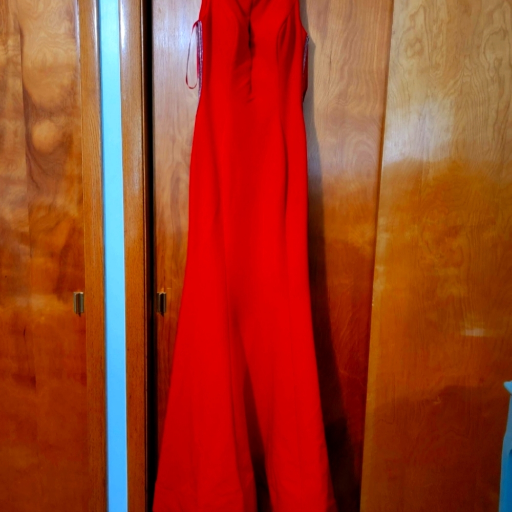 Red prom dress eith flowing train